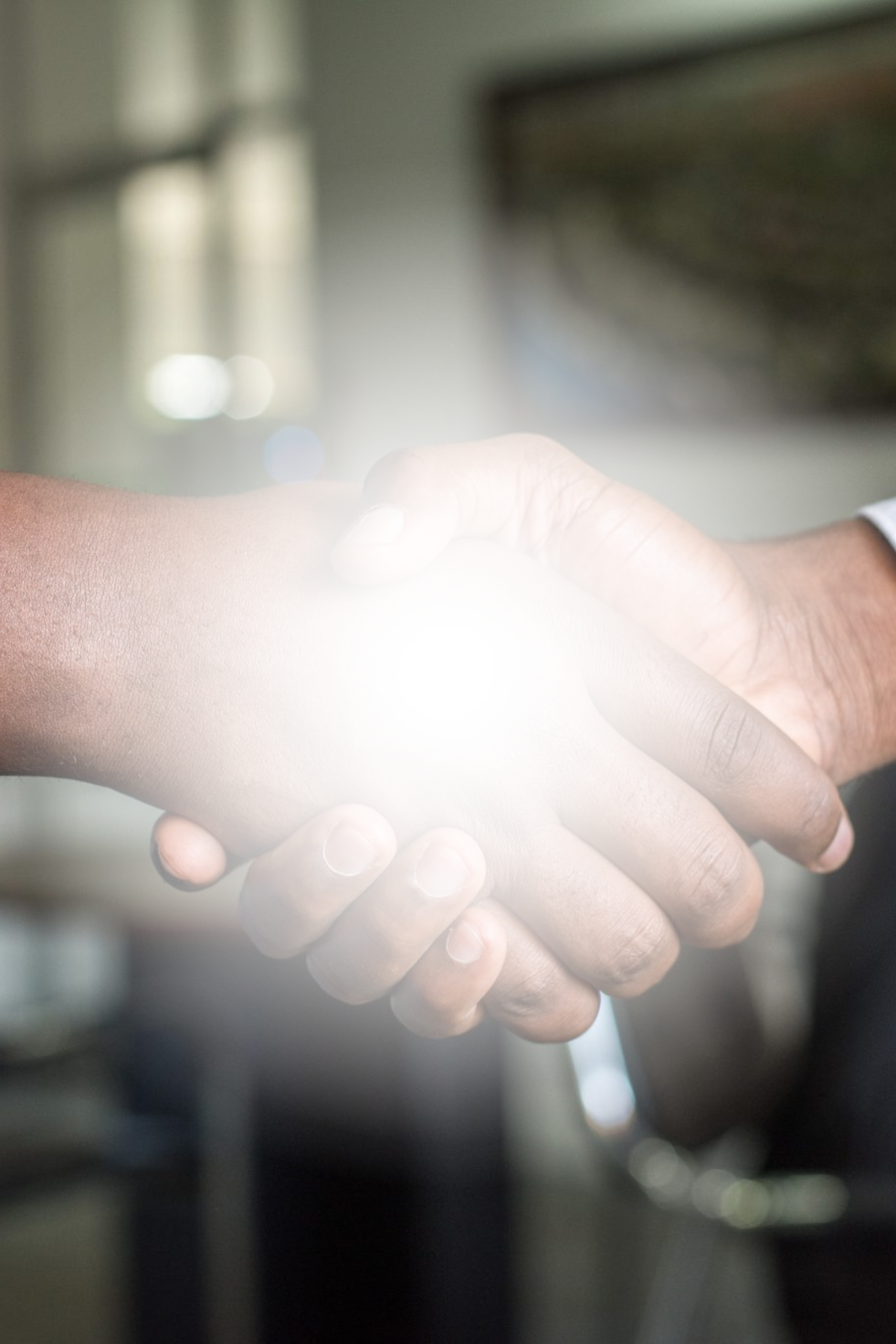 Two individuals shaking hands. Employers can collaborate with FOCUS on a job fair to fill multiple vacant positions.